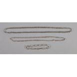 Two Italian silver necklaces including figaro chain and silver bracelet. 32.2g.