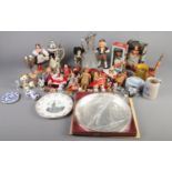 A box of miscellaneous. Including Wade figures, dolls from around the world, blue Wedgwood