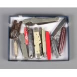 A quantity of assorted penknives including engraved examples and folding scissors.