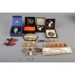 A box of collectables. Includes Swarovski wristwatch, Ben Sherman wristwatch. Peter Bates Ltd