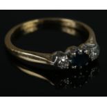 An 18ct gold & platinum sapphire & diamond ring. Size K. 2.2g.