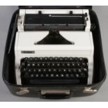 A cased Erika manual typewriter.