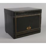 A 19th century ebonised table top liqueur cabinet, having hinged top, sides and front. Housing a