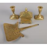 Antique brassware; Includes a pair of Georgian extractor candlesticks, Recency tobacco box and a