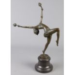 An Art Deco style bronze figure modelled as a fire dancer, raised on marble base. Signed indistinct.
