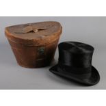 A Lincoln Bennett & Co mole skin top hat in original leather case. Front to back 19.5cm, Side to