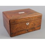 A Victorian rosewood box with mother of pearl inlay and fitted interior.