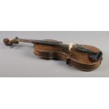 An antique one piece back violin housed in inlaid walnut case. Bearing label 'Nicolaus Amatus