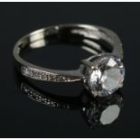 A 9ct white gold cubic zirconia ring. Size N. 2g.