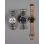 Three wristwatches including men's Accurist and ladies Fossil and Radley.