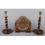 An Art Deco walnut mantel clock with inlaid decoration along with a pair oak barley twist