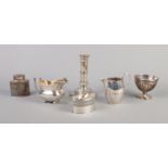Six pieces of Georgian Sheffield plate. Includes two cream jugs, candlestick, tea caddy, bowl and