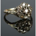An 18ct gold diamond cluster ring. Approximately 1.25ct diamond. Size P. 3.4g.