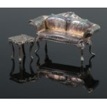 An early 20th century silver continental sofa, along with a similar white metal table. Possibly