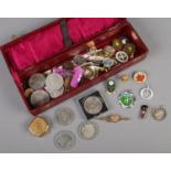 A box of mostly coins and badges. Including commemorative crowns, sporting badges, Stratton pill