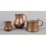 Three Georgian copper vessels. Includes small jug, mug and cooking pot. Tallest 15.5cm.