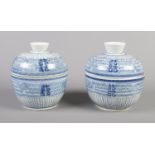 A pair of eighteenth century Chinese rice bowls and covers, decorated in underglaze blue. 14.5cm