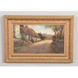 A late 19th/early 20th century gilt framed oil on board, landscape scene, country lane with a