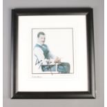 A framed Freddie Mercury photograph with certificate of authenticity.