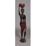 A large African carved ebony / bog oak tribal figure of a woman. 100cm in height. Some repair