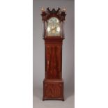 A Georgian mahogany eight day longcase clock by Thomas Ogden, Halifax. With twin swan neck pediment.