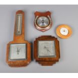 A quantity of wall mount wood barometers including example with horseshoe decoration.