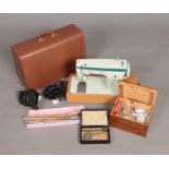 A Singer 257 sewing machine with original case. Also a quantity of assorted crafting items including