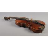 A 19th century two piece back violin, labelled for Joseph Guarnerius dated 1886. In wooden case with