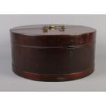 A Georgian mahogany circular box, possibly a hat box. Diameter 41cm. Crack along top of box. Parts