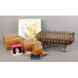 An assortment of collectables, to include a trio of graduating hinged carved boxes, iron log