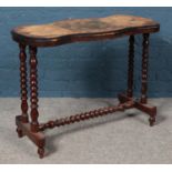 A Victorian games table with bobbin turned supports and central bobbin stretcher. Height: 68cm,