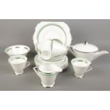 An Art Deco Shelley tea service. Decorated with green and silvered borders. Sugar bowl cracked.