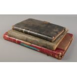 Two early to mid 20th century ledgers for Brooks & Brooks Tobacconist along with a Tobacco Year