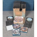 A box of cabinet plates. Including Dalina, boxed Christmas Royal Worcester plates, etc.