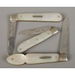 Three silver bladed and mother of pearl fruit knives, all assayed for Sheffield; 1881, 1909 (and