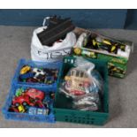 A collection of diecast vehicles, Scalextric cars and track and a boxed radio controlled car.
