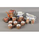 A quantity of oriental ceramics including satsuma style jars, tea set and gravy boat.