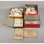 A large quantity of assorted cigarette cards including two collectors albums. Mostly John