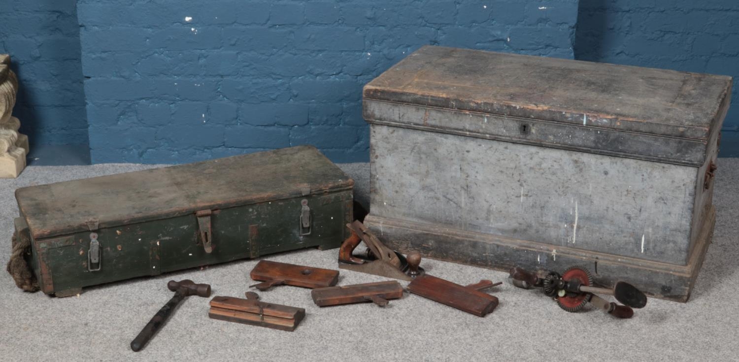 An engineers chest with contents of tools along with a vintage ammo crate.