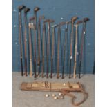 A quantity of vintage golf clubs. Including Mashie, Arrow putter, Spalding, etc.