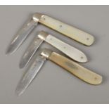 Three silver bladed and mother of pearl fruit knives. All assayed for Sheffield, 1920, 1921 and 1931