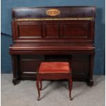 A mahogany John Brinsmead & Sons overstrung upright piano with mahogany piano stool.