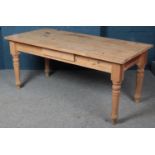 A pine kitchen table with drawer to two sides. (80cm x 180cm x 86cm) Stain marks to the top.