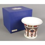 A boxed Royal Crown Derby vase in the Imari pattern. 1128 LIII to the base.