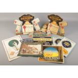 A collection of vintage tobacco and cigarette related display stands.