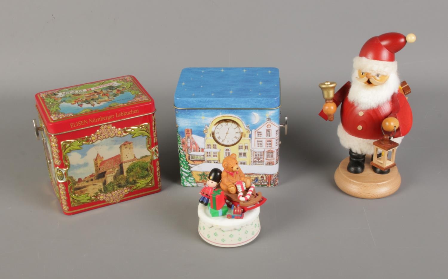 A quantity of Christmas items including pair of German music tins, Schmid musical ornament and