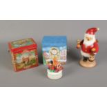 A quantity of Christmas items including pair of German music tins, Schmid musical ornament and