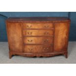 A mahogany bow front sideboard with four central drawers, two cupboards and semi-fitted interior.