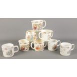 A collection of Royal Doulton Bunnykins and Wedgwood Peter Rabbit mugs.