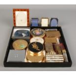 A collection of lighters, compacts and miniature photo frames. To include Stratton and Ronson